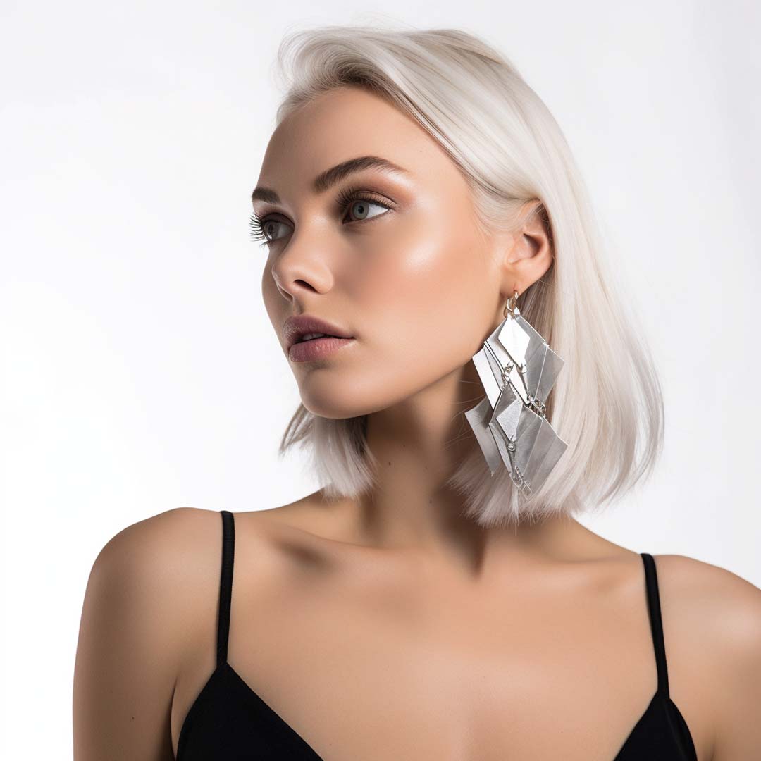 Minimalist sterling silver stud earrings featuring a sleek and modern design from Joias & More.